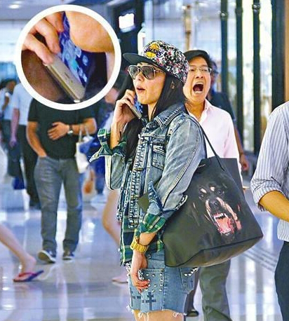 张柏芝为躲避狗仔队现场演戏 手机拿反漏破绽 张柏芝为躲避狗仔队现场演戏 手机拿反漏破绽